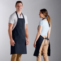 Choice Navy Blue Poly-Cotton Standard Bib Apron with 2 Pockets - 34" x 30"