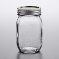 Ball 1440061501 16 oz. Pint Regular Mouth Smooth Sided Glass Canning Jar with Silver Metal Lid and Band - 12/Case