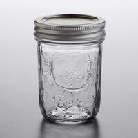 Ball 60000ZFP 8 oz. Half-Pint Regular Mouth Glass Canning Jar with Silver Metal Lid and Band - 12/Case