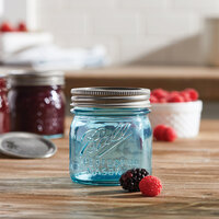 Ball 1440069053 8 oz. Half-Pint Aqua Vintage Regular Mouth Glass Canning Jar with Silver Metal Lid and Band - 4/Pack