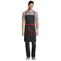 Uncommon Threads 3104 Black Customizable Poly-Cotton Rebel Bib Apron with Red Webbing and 3 Pockets - 34 inchL x 36 inchW