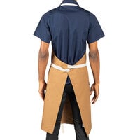 Uncommon Threads 3104 Caramel Customizable 100% Cotton Rebel Bib Apron with Natural Webbing and 3 Pockets - 34 inch x 36 inch