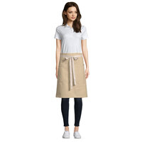 Uncommon Threads 3117 Light Beige Customizable 100% Cotton Canvas Moxie Waist Apron with Natural Webbing and 3 Pockets - 24 inchL x 34 inchW