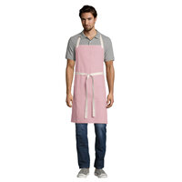 Uncommon Threads 3115 Coral Pink Customizable 100% Cotton Canvas Vibe Bib Apron with Natural Webbing and 3 Pockets - 34 inchL x 36 inchW