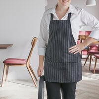 Choice Black and White Pinstripe Front of House Bib Apron with 3 Pockets - 25 inchL x 28 inchW