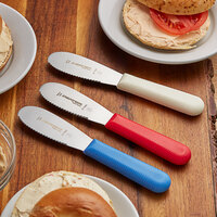 Dexter-Russell 18343 Sani-Safe 3-Pack 3 1/2 inch Scalloped Sandwich Spreaders in Red, White, and Blue