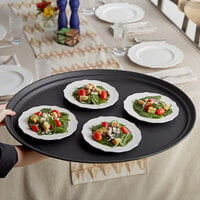 Choice 27 inch x 22 inch Black Oval Non-Skid Serving Tray