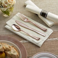 Gold Visions 18 inch x 15 1/2 inch Pre-Rolled Linen-Feel White Napkin and Classic Heavy Weight Rose Gold Plastic Cutlery Set - 100/Case