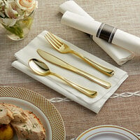 Visions 18 inch x 15 1/2 inch Pre-Rolled Linen-Feel White Napkin and Classic Heavy Weight Gold Plastic Cutlery Set - 100/Case