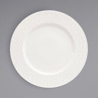 Front of the House DDP083BEP22 Catalyst Facet 10 5/8" European White Embossed Wide Rim Round Porcelain Plate - 6/Case