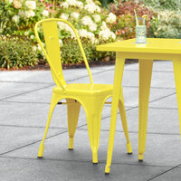 Lancaster Table & Seating Alloy Series Yellow Metal Indoor / Outdoor Industrial Cafe Chair with Vertical Slat Back and Drain Hole Seat