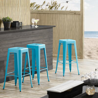 Lancaster Table & Seating Alloy Series Arctic Blue Stackable Metal Indoor / Outdoor Industrial Barstool with Drain Hole Seat