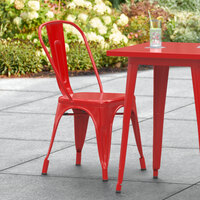 Lancaster Table & Seating Alloy Series Red Metal Indoor / Outdoor Industrial Cafe Chair with Vertical Slat Back and Drain Hole Seat