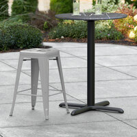 Lancaster Table & Seating Alloy Series Silver Stackable Metal Indoor / Outdoor Industrial Cafe Counter Height Stool with Drain Hole Seat