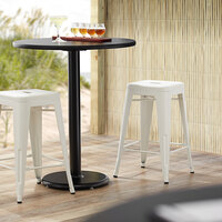 Lancaster Table & Seating Alloy Series White Stackable Metal Indoor / Outdoor Industrial Cafe Counter Height Stool with Drain Hole Seat