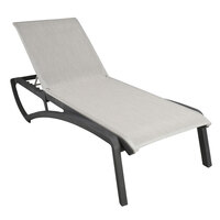 Grosfillex US023288 Sunset Volcanic Black Chaise Lounge with Beige Sling Seat - 12/Case
