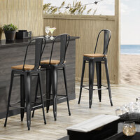 Lancaster Table & Seating Alloy Series Distressed Black Metal Indoor Industrial Cafe Bar Height Stool with Vertical Slat Back and Natural Wood Seat