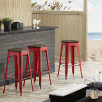 Lancaster Table & Seating Alloy Series Distressed Red Metal Indoor Industrial Cafe Bar Height Stool with Walnut Wood Seat