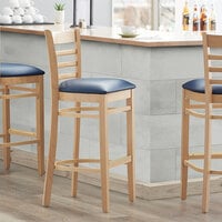 Lancaster Table & Seating Natural Ladder Back Bar Height Chair with 2 1/2 inch Navy Padded Seat - Detached Seat