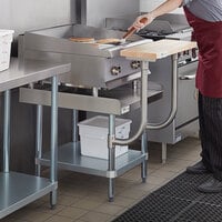 Regency 30 inch x 24 inch 16-Gauge Stainless Steel Equipment Stand with Galvanized Undershelf and 10 inch Wooden Adjustable Cutting Board