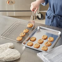 Choice Quarter Size 19 Gauge 9 1/2 inch x 13 inch Wire in Rim Aluminum Sheet Pan with Footed Cooling Rack