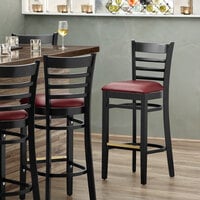 Lancaster Table & Seating Black Ladder Back Bar Height Chair with Burgundy Padded Seat - Detached Seat