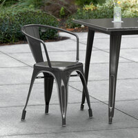 Lancaster Table & Seating Alloy Series Distressed Black Metal Indoor / Outdoor Industrial Cafe Arm Chair