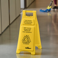 Continental 119 26 inch Yellow Trilingual Double Sided Caution Wet Floor Sign