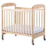Foundations 2532040 Serenity 24 inch x 38 inch Natural Compact Fixed-Side Clearview Wood Crib with Adjustable Mattress Board and 3 inch InfaPure Mattress