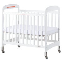 Foundations 2532120 Serenity 24 inch x 38 inch White Compact Fixed-Side Clearview Wood Crib with Adjustable Mattress Board and 3 inch InfaPure Mattress