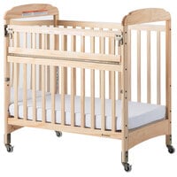 Foundations 2543040 Serenity SafeReach 24 inch x 38 inch Natural Compact Clearview / Mirror Wood Crib with Safety Access Gate, Adjustable Mattress Board, and 3 inch InfaPure Mattress