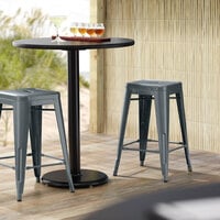 Lancaster Table & Seating Alloy Series Charcoal Stackable Metal Outdoor Industrial Cafe Counter Height Stool with Drain Hole Seat