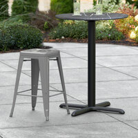 Lancaster Table & Seating Alloy Series Charcoal Stackable Metal Outdoor Industrial Cafe Counter Height Stool with Drain Hole Seat