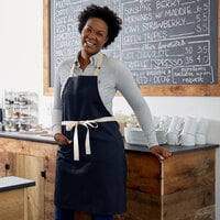 Choice Navy Blue Adjustable Bib Apron with 2 Pockets and Natural Webbing Accents - 32 inchL x 30 inchW
