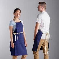 Choice Royal Blue Adjustable Bib Apron with 2 Pockets and Natural Webbing Accents - 32 inch x 30 inch