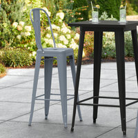 Lancaster Table & Seating Alloy Series Charcoal Metal Indoor / Outdoor Industrial Cafe Barstool with Vertical Slat Back and Drain Hole Seat