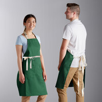 Choice Kelly Green Adjustable Bib Apron with 2 Pockets and Natural Webbing Accents - 32 inch x 30 inch