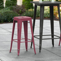 Lancaster Table & Seating Alloy Series Distressed Sangria Stackable Metal Indoor / Outdoor Industrial Barstool with Drain Hole Seat
