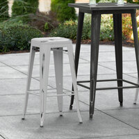 Lancaster Table & Seating Alloy Series Distressed Silver Stackable Metal Indoor / Outdoor Industrial Barstool with Drain Hole Seat