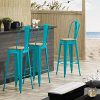 Lancaster Table & Seating Alloy Series Teal Metal Indoor Industrial Cafe Bar Height Stool with Vertical Slat Back and Natural Wood Seat