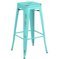 Lancaster Table & Seating Alloy Series Distressed Seafoam Stackable Metal Indoor / Outdoor Industrial Barstool with Drain Hole Seat