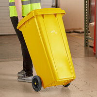 Lavex Janitorial 32 Gallon Yellow Wheeled Rectangular Trash Can with Lid