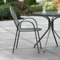 Lancaster Table & Seating Harbor Black Powder Coated Steel Stackable Outdoor Armchair