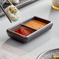 Acopa Heika 1 oz. Black Matte Textured Rectangular 2-Compartment Stoneware Sauce Dish - 12/Case