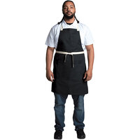 Uncommon Threads 3127 Black Customizable Poly-Cotton Avalanche Bib Apron with Natural Webbing and 3 Pockets - 34 inchL x 23 inchW