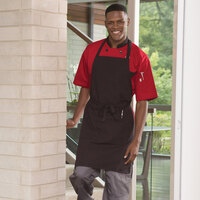 Uncommon Threads 3018 Black and Red Pinstripe Customizable Poly-Cotton Butcher Bib Apron with 2 Pockets - 34 inchL x 23 inchW