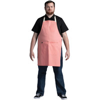 Uncommon Threads 3127 Coral Pink Customizable Poly-Cotton Avalanche Bib Apron with Natural Webbing and 3 Pockets - 34 inchL x 23 inchW