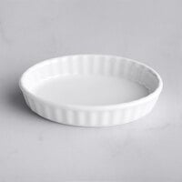 Tuxton BPK-0502 5 oz. Porcelain White Fluted Oval China Creme Brulee Dish - 12/Case