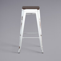 Lancaster Table & Seating Alloy Series Distressed White Stackable Metal Indoor Industrial Barstool with Black Wood Seat