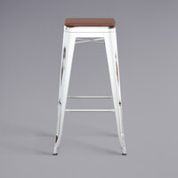 Lancaster Table & Seating Alloy Series Distressed White Stackable Metal Indoor Industrial Barstool with Walnut Wood Seat